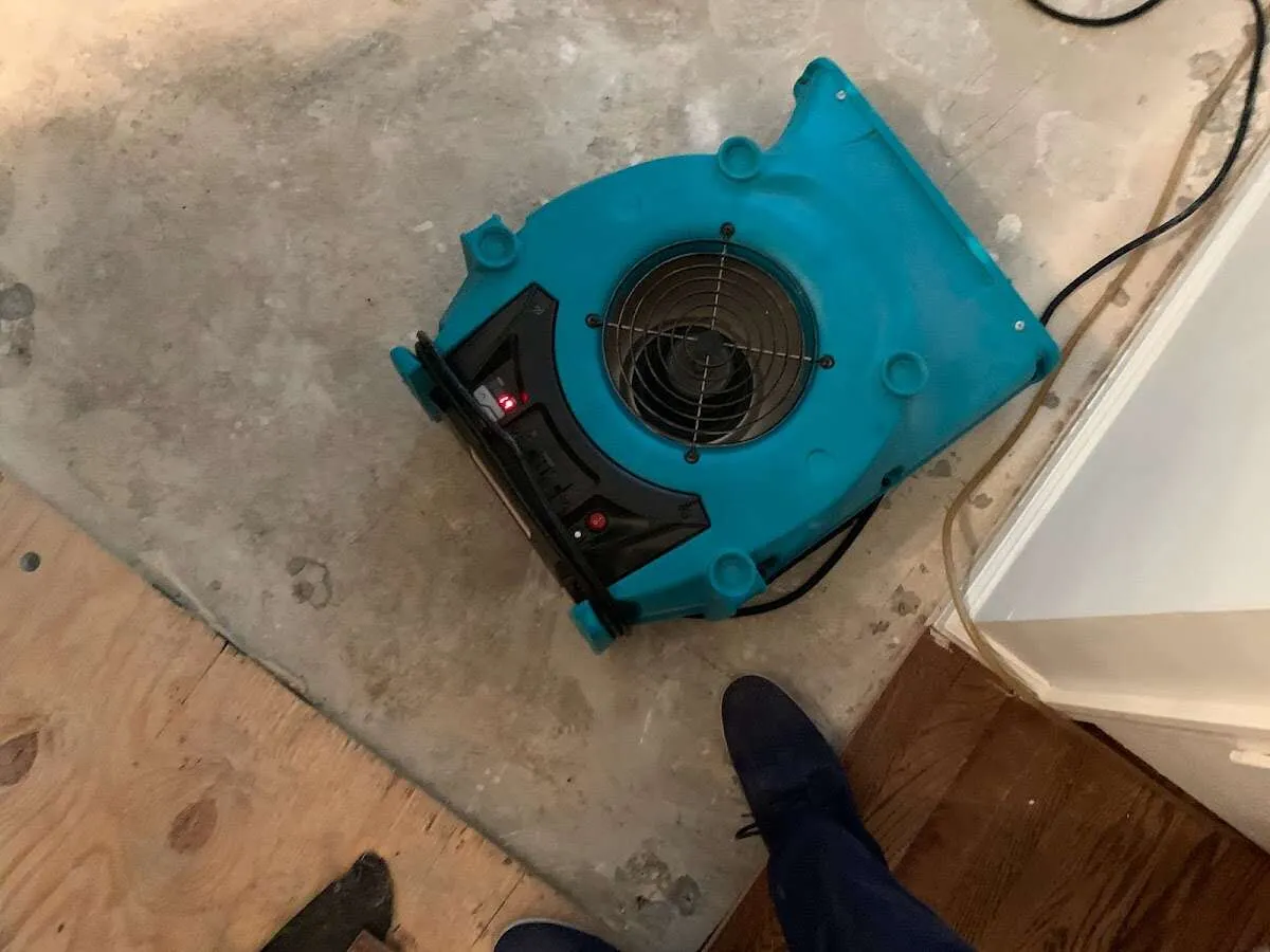 Air mover drying subfloor during Leak Detection & Repair in Tipp City